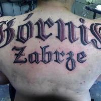 Napis Górnik Zabrze tatuaż