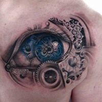 Niebieskie oko i mechanizm tatuaż