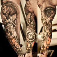 Tatuaz na którym jest anioł zagar i oko