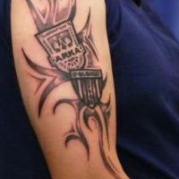Tribal logo Arka Gdynia tatuaż